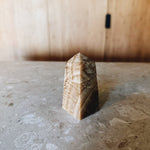 Chocolate calcite obelisk Palace of Nowhere