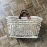 Large woven straw basket with leather handles Palace of Nowhere