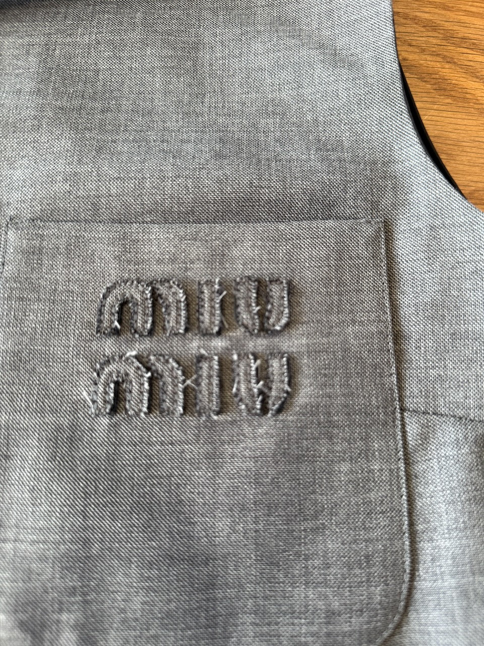 Miu Miu Grisaille logo embroidered sleeveless top Palace of Nowhere