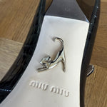 Miu Miu black embossed patent leather heels Palace of Nowhere