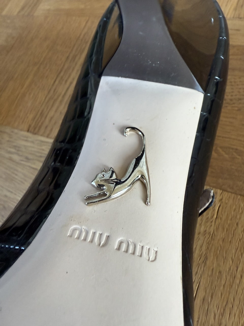 Miu Miu black embossed patent leather heels Palace of Nowhere