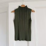 Shop Issey Miyake Pleats Please funnel neck top in khaki green at Palace of Nowhere