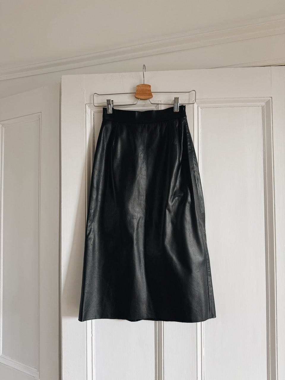 Vintage Prada Y2K black leather midi skirt at Palace of Nowhere
