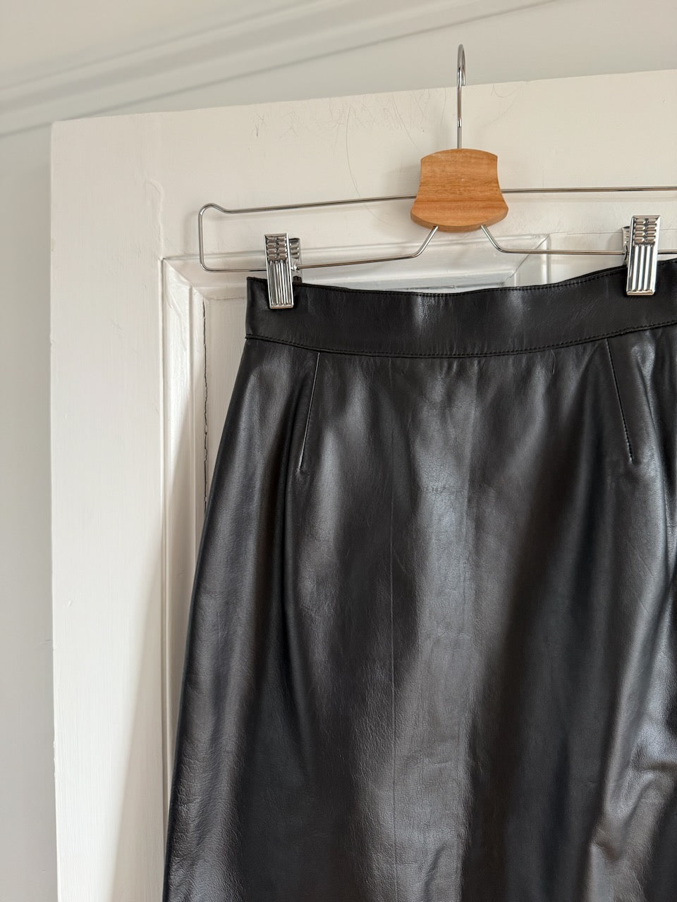 Vintage Prada Y2K black leather midi skirt at Palace of Nowhere