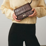 Chylak glossy brown crocodile leather belt bag at Palace of Nowhere