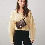 Chylak glossy brown crocodile leather belt bag at Palace of Nowhere