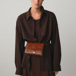 Chylak caramel crocodile leather belt bag at Palace of Nowhere